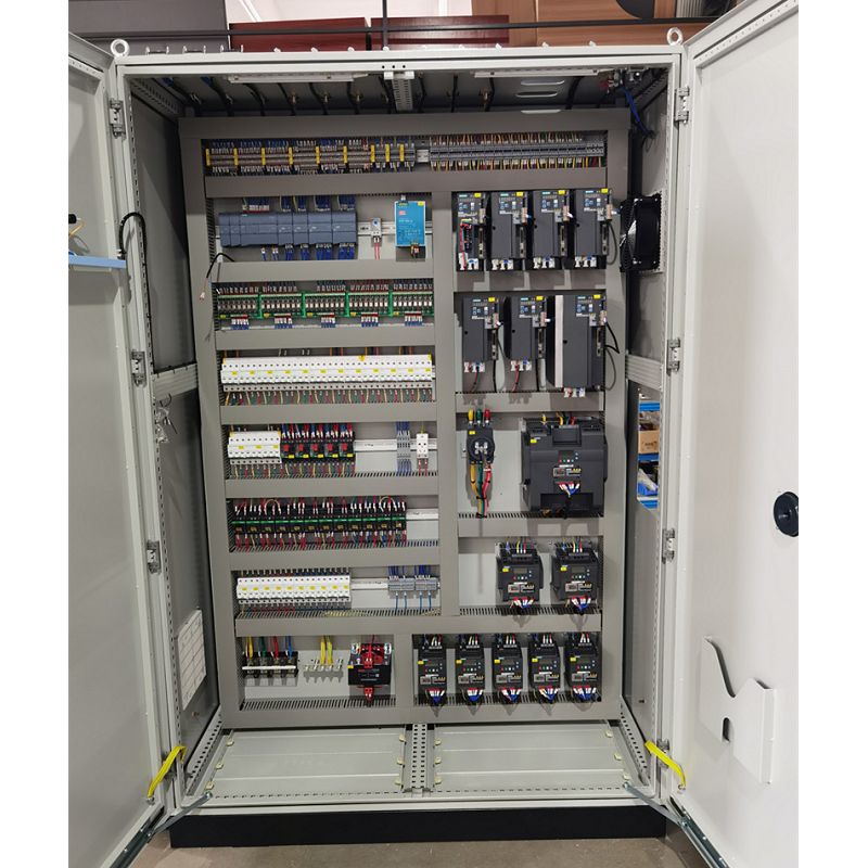Industrial control cabinet with PLC modules, relays and organized wiring