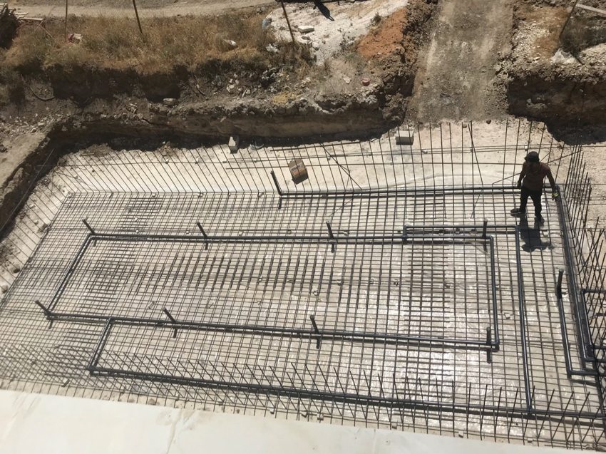 Overhead view of pool pipework arranged within the reinforced floor